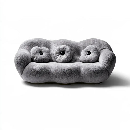 Sofá con contorno acolchado y cojines redondos - gris
